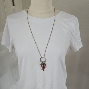 Long Gold-Tone Necklace with Pink Teardrop and Charm Cluster